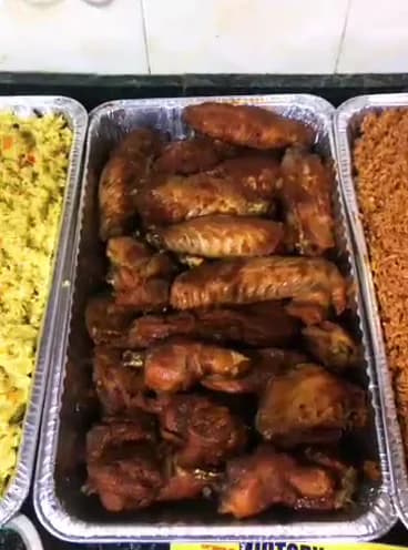 Food trays plated for service — A close pass over freshly plated food trays prepared for an event order.